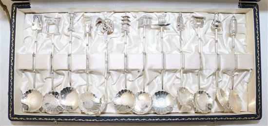 A set of twelve Japanese novelty silver teaspoons, early 20th century, each approx. 10.5cm, cased